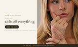 ANETT sale banner: 20% off everything. Model wearing stacked gold rings with cubic zirconia stones.