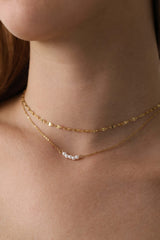 Veloura Pearl Necklace in stainless steel—five dainty pearls floating on a shimmer-ready chain, waterproof and giftable for everyday glow
