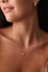 Sasha Love Heart Half Pavé Necklace in 18K gold-plated sterling silver, featuring a delicate heart charm with half pavé crystal detailing—elegant, hypoallergenic, and perfect for layering