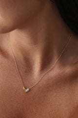 Sasha Love Heart Half Pavé Necklace in 18K gold-plated sterling silver, featuring a delicate heart charm with half pavé crystal detailing—elegant, hypoallergenic, and perfect for layering