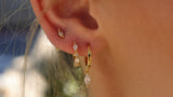 Gold-plated ear stack with cubic zirconia marquise studs and huggie hoops