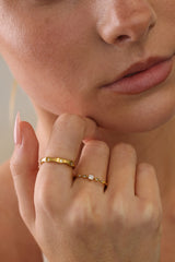 Model wearing the Colette vintage five stone ring with a gold star band