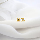 Olivia Stud earrings in gold — a small round cubic zirconia stud, option C in the Cleo stack.