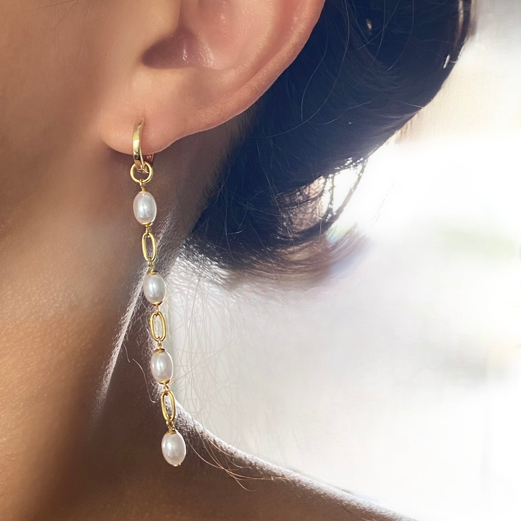 Long dangling hot sale pearl earrings