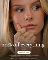 ANETT sale banner: 20% off everything. Model wearing stacked gold rings with cubic zirconia stones.