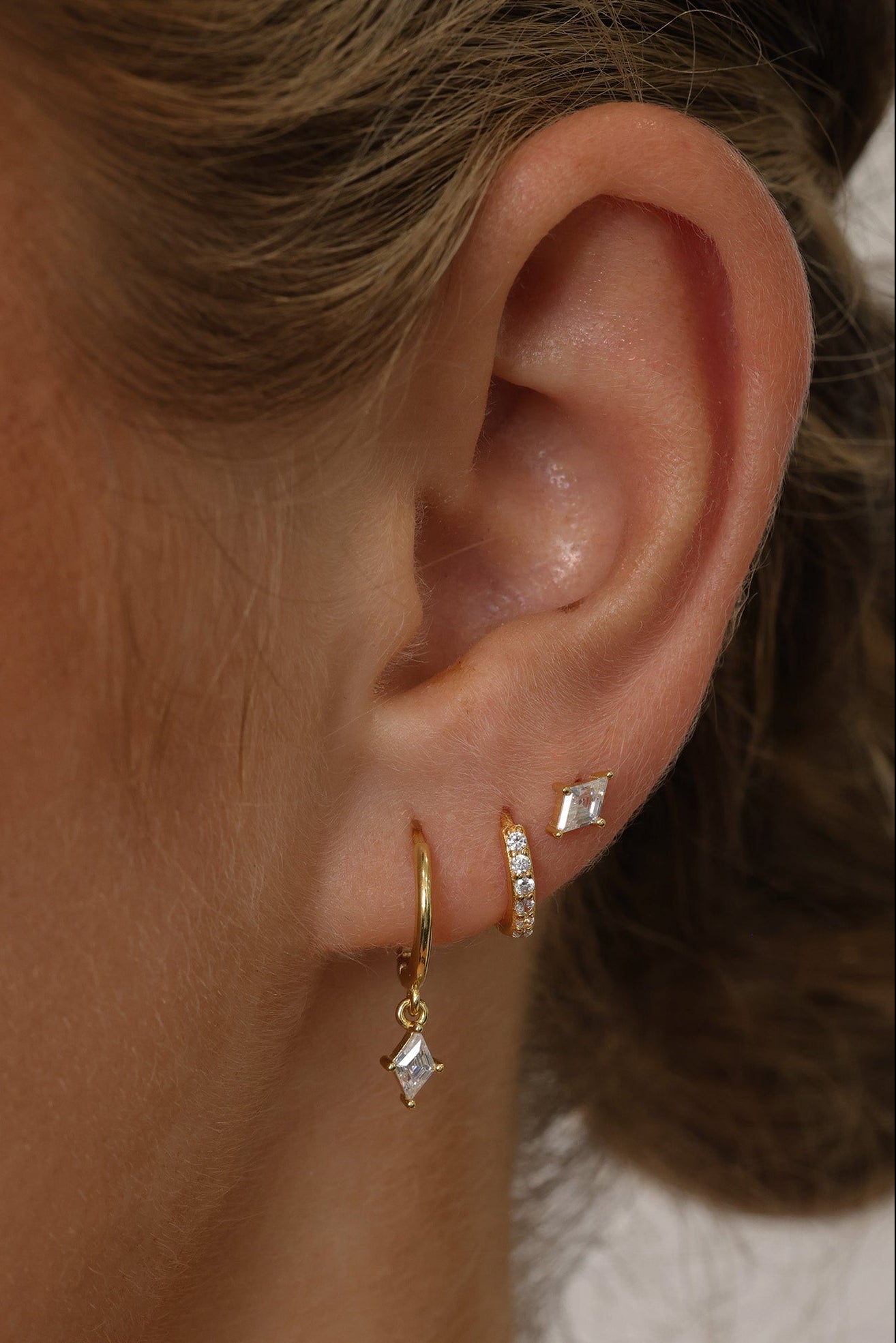 Cubic zirconia dangle drop earring set featuring brilliant faceted stones that sparkle from every angle. Includes three coordinating pieces that can be worn together or individually for an elegant, sophisticated look.