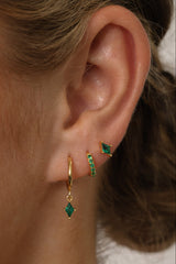 Emerald green cubic zirconia dangle drop earring set featuring brilliant faceted stones that sparkle from every angle. Includes three coordinating pieces that can be worn together or individually for an elegant, sophisticated look.