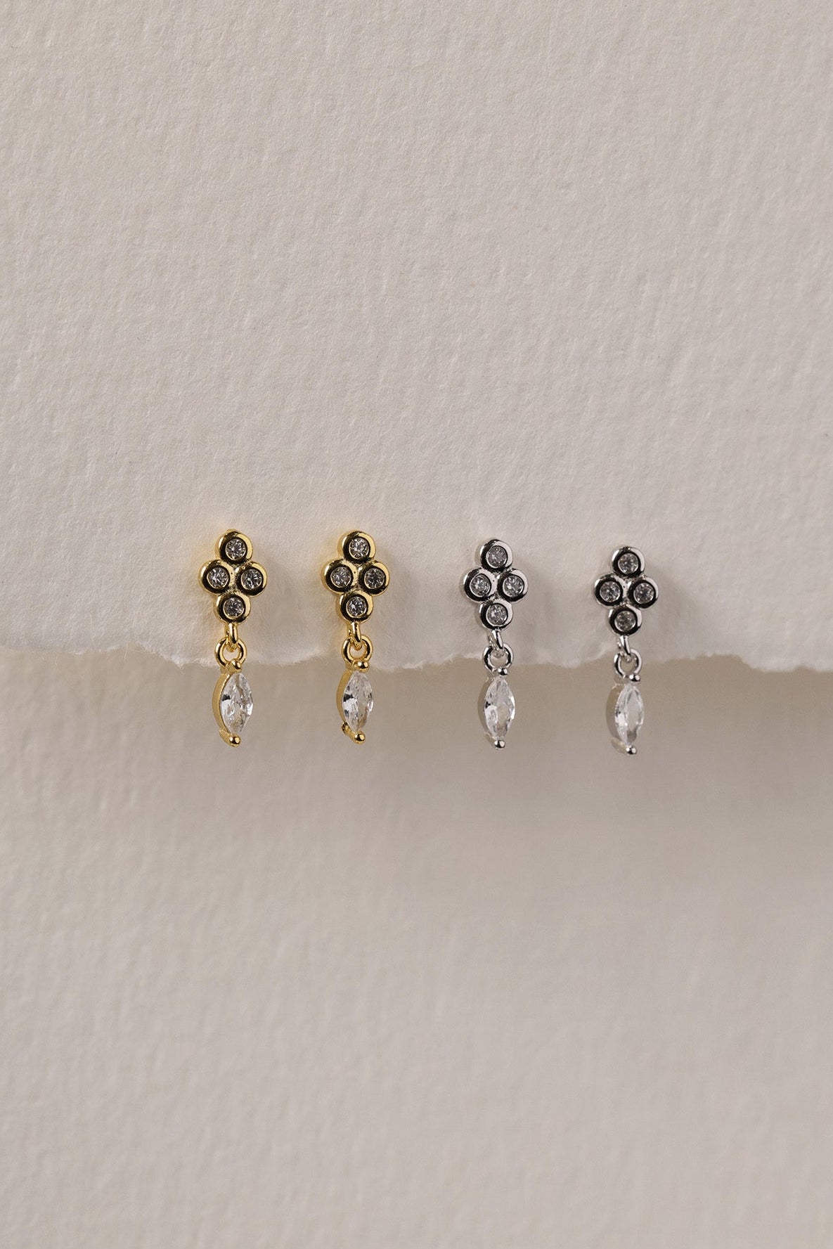Rhodium-plated 925 sterling silver dangle stud earrings with a cubic zirconia drop