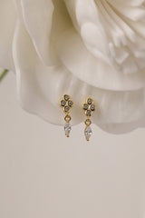A delicate pair of dangle stud earrings with a refined, light‑catching drop. Crafted in rhodium‑plated 925 sterling silver with premium AAAAA cubic zirconia, they offer timeless sparkle for everyday wear or special occasions.