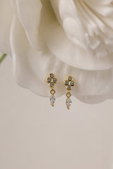 Pair of Nova gold drop earrings — three bezel-set stones above a marquise drop