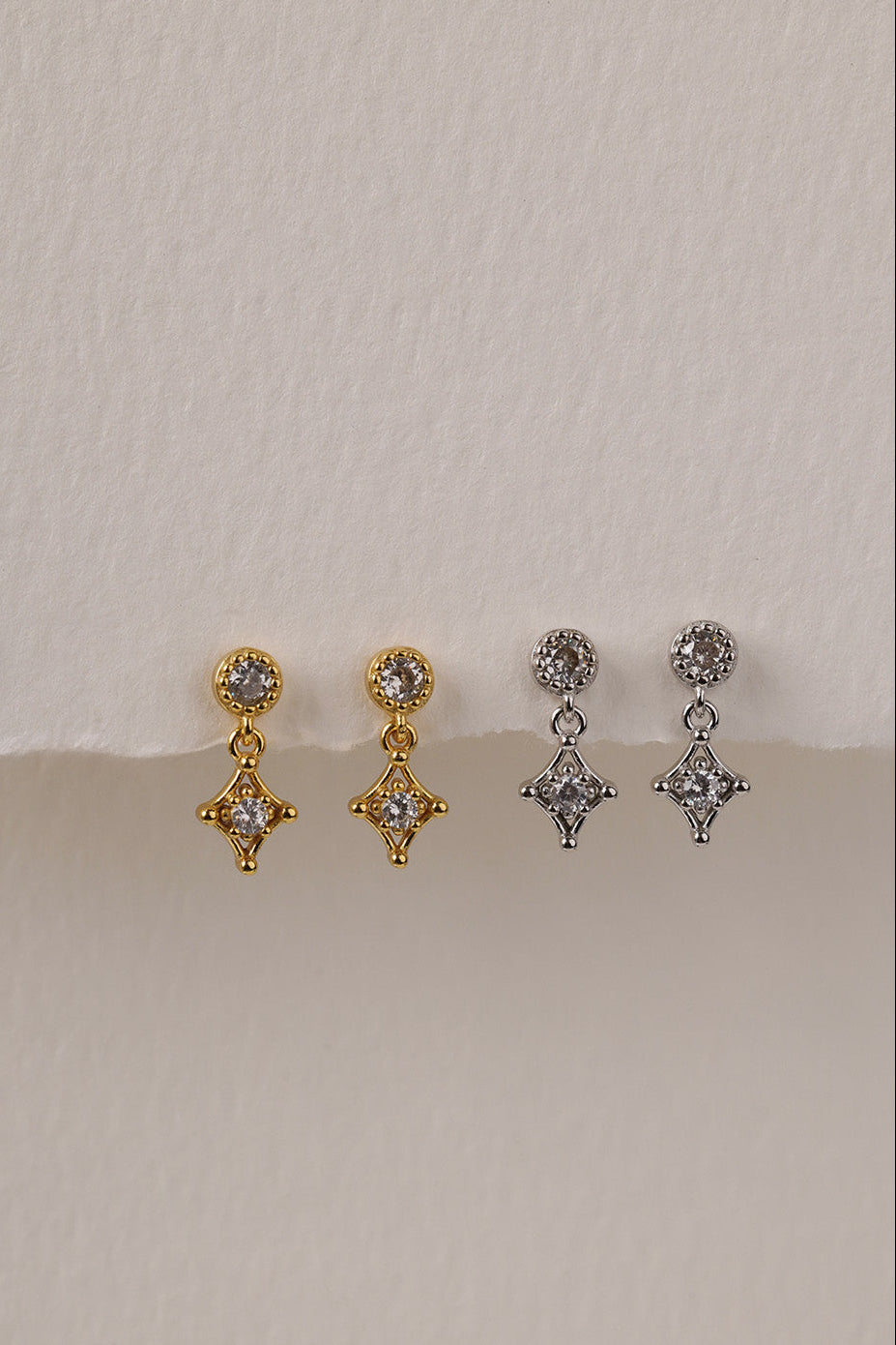 Dangle stud earrings with a sparkling cubic zirconia drop charm