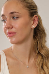 Small freshwater pearl stud earring worn on the earlobe, shown in a gold stainless steel setting.