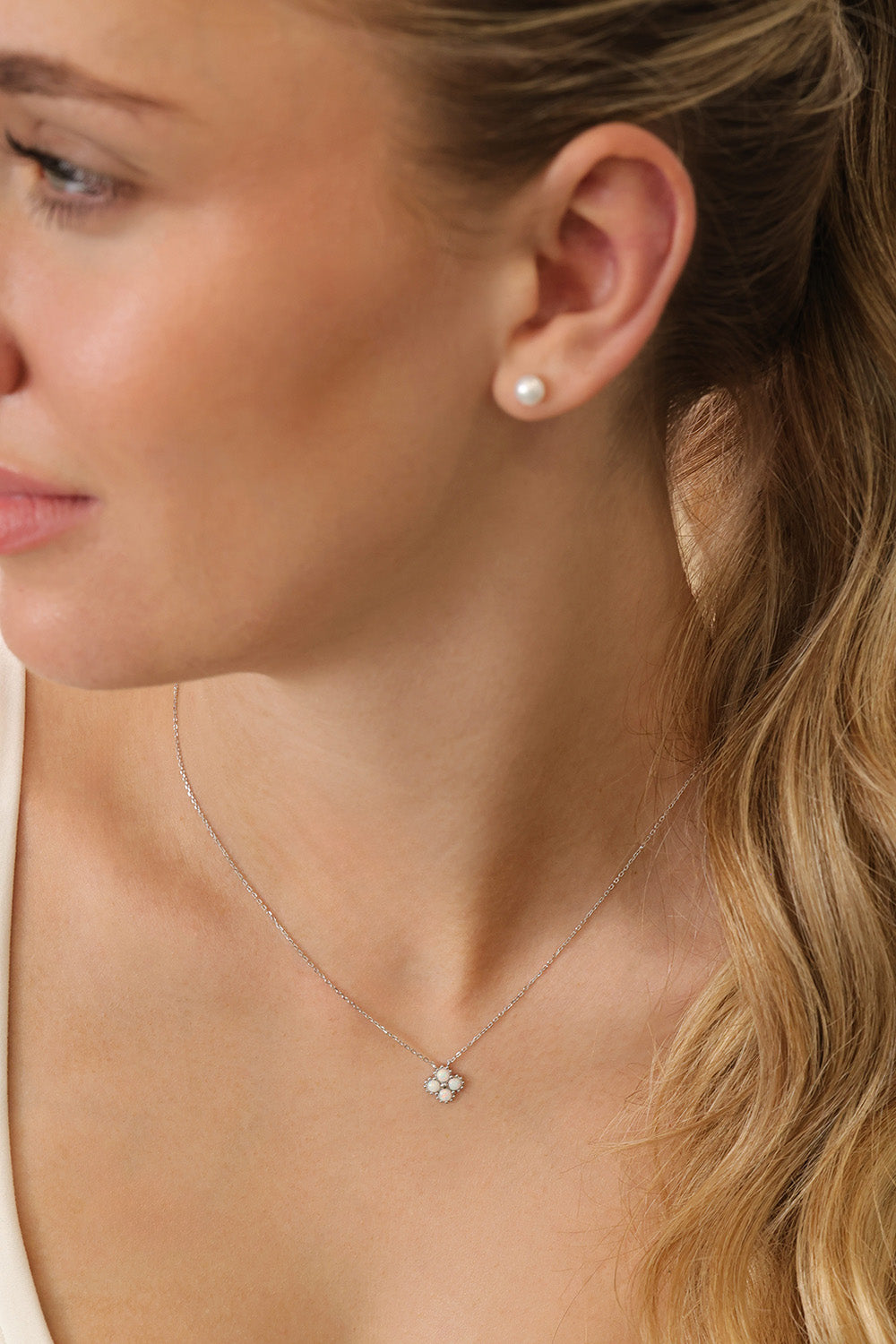 rhodium‑plated sterling silver opal clover pendant necklace with a delicate shine and minimalist charm.