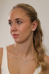 rhodium‑plated sterling silver opal clover pendant necklace with a delicate shine and minimalist charm.