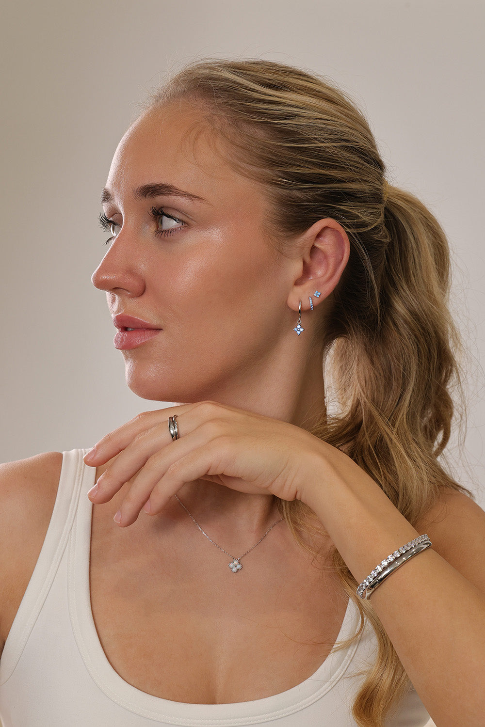 rhodium‑plated sterling silver opal clover pendant necklace with a delicate shine and minimalist charm.