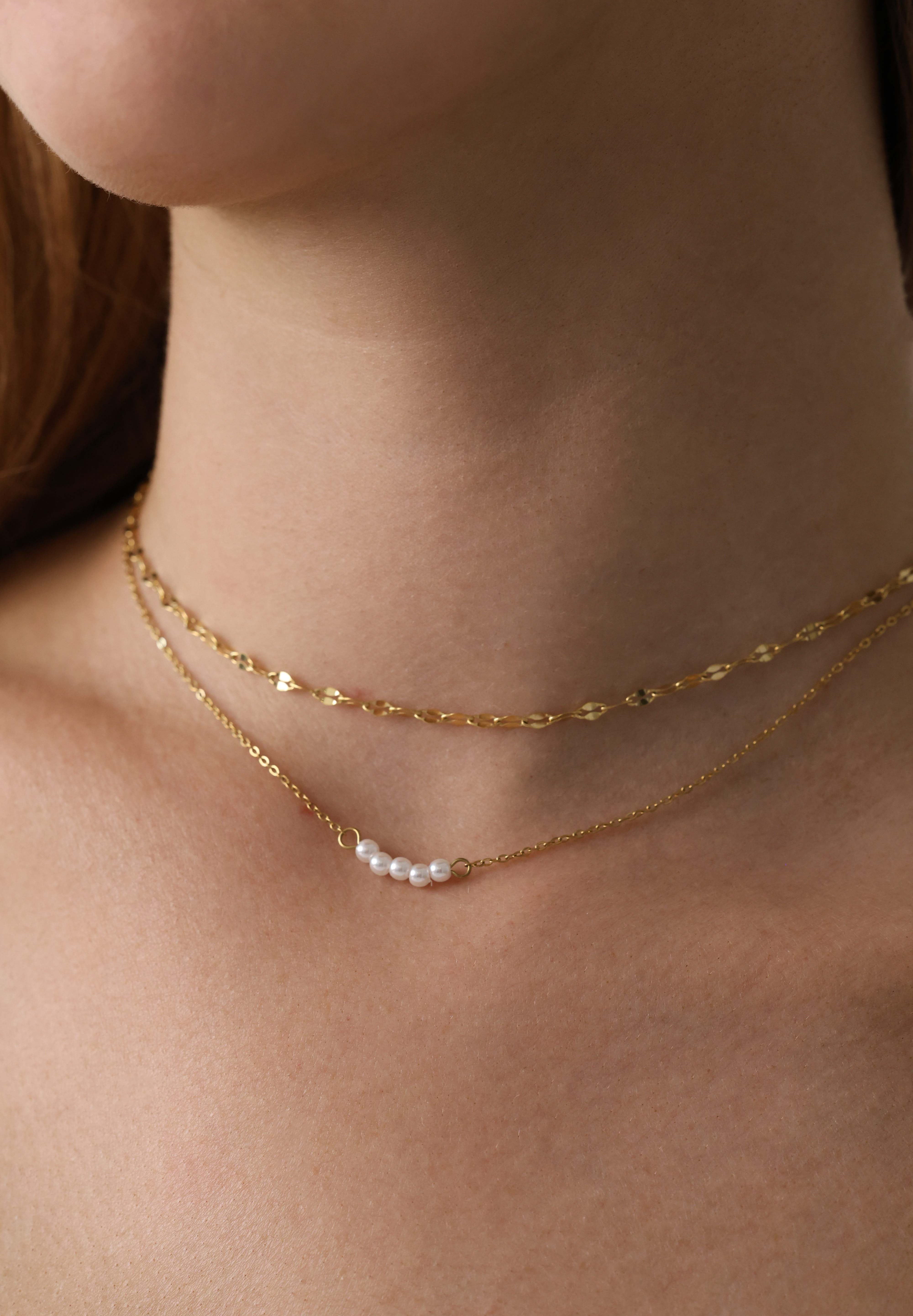 Veloura Pearl Necklace in stainless steel—five dainty pearls floating on a shimmer-ready chain, waterproof and giftable for everyday glow