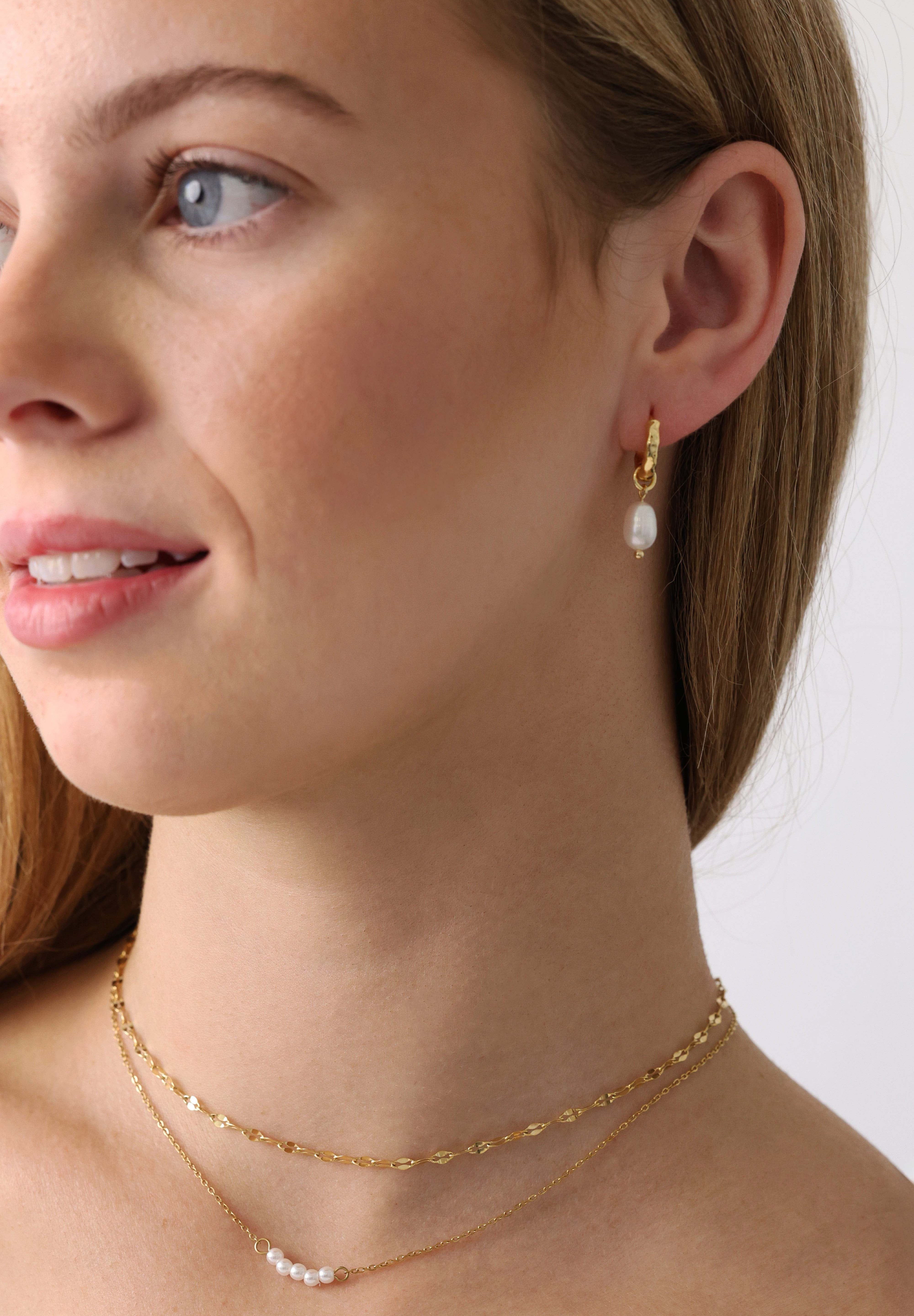 Veloura Pearl Necklace in stainless steel—five dainty pearls floating on a shimmer-ready chain, waterproof and giftable for everyday glow