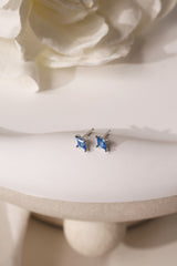 Mia Blue Huggie Dangle Earrings in Sterling Silver – rhodium-plated hoops with blue cubic zirconia, hypoallergenic dainty silver earrings for women, available individually or as part of 3-pair earring stack set