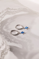 Mia Blue Huggie Dangle Earrings in Sterling Silver – rhodium-plated hoops with blue cubic zirconia, hypoallergenic dainty silver earrings for women, available individually or as part of 3-pair earring stack set