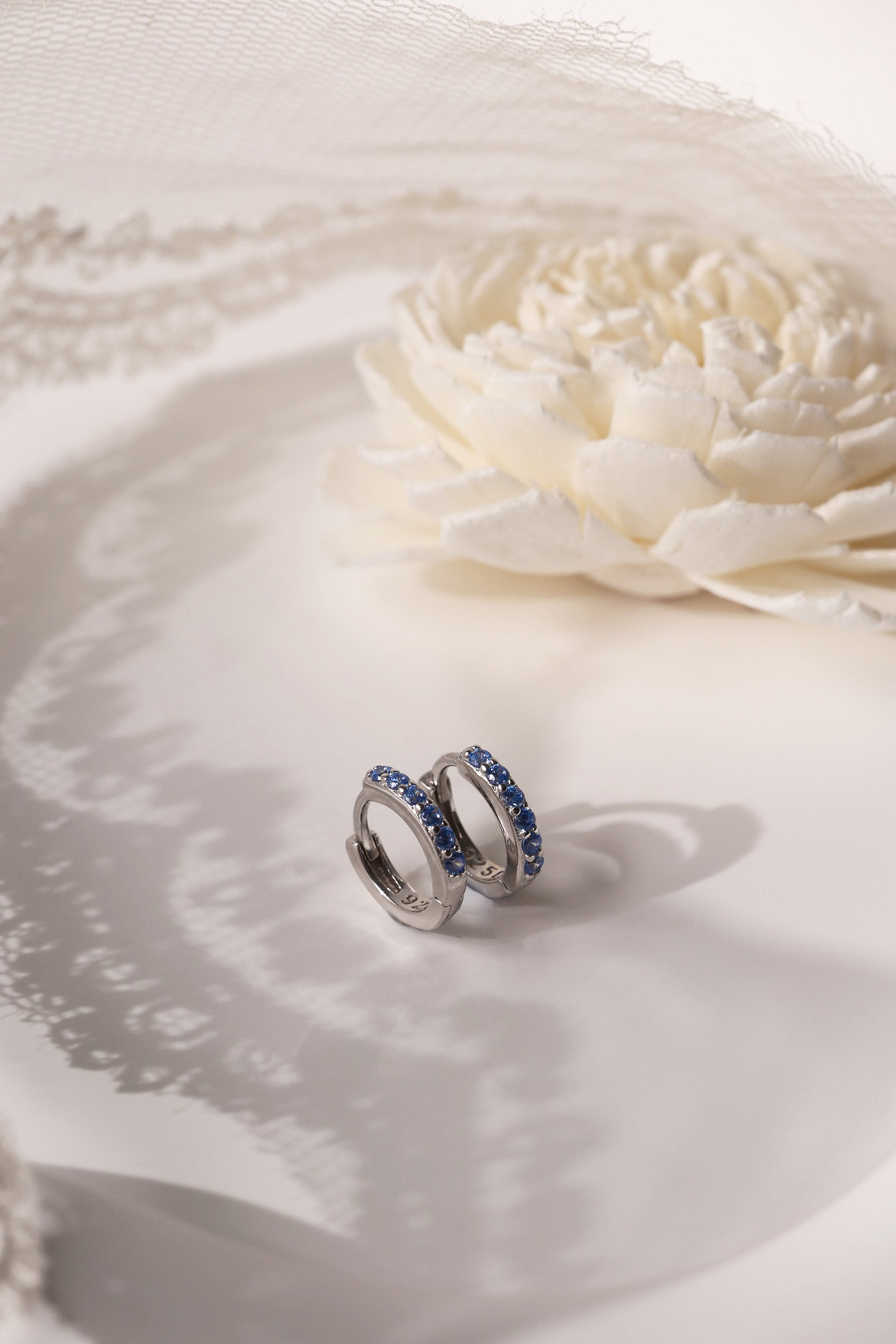 Mia Blue Huggie Dangle Earrings in Sterling Silver – rhodium-plated hoops with blue cubic zirconia, hypoallergenic dainty silver earrings for women, available individually or as part of 3-pair earring stack set