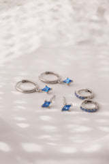 Mia Blue Huggie Dangle Earrings in Sterling Silver – rhodium-plated hoops with blue cubic zirconia, hypoallergenic dainty silver earrings for women, available individually or as part of 3-pair earring stack set