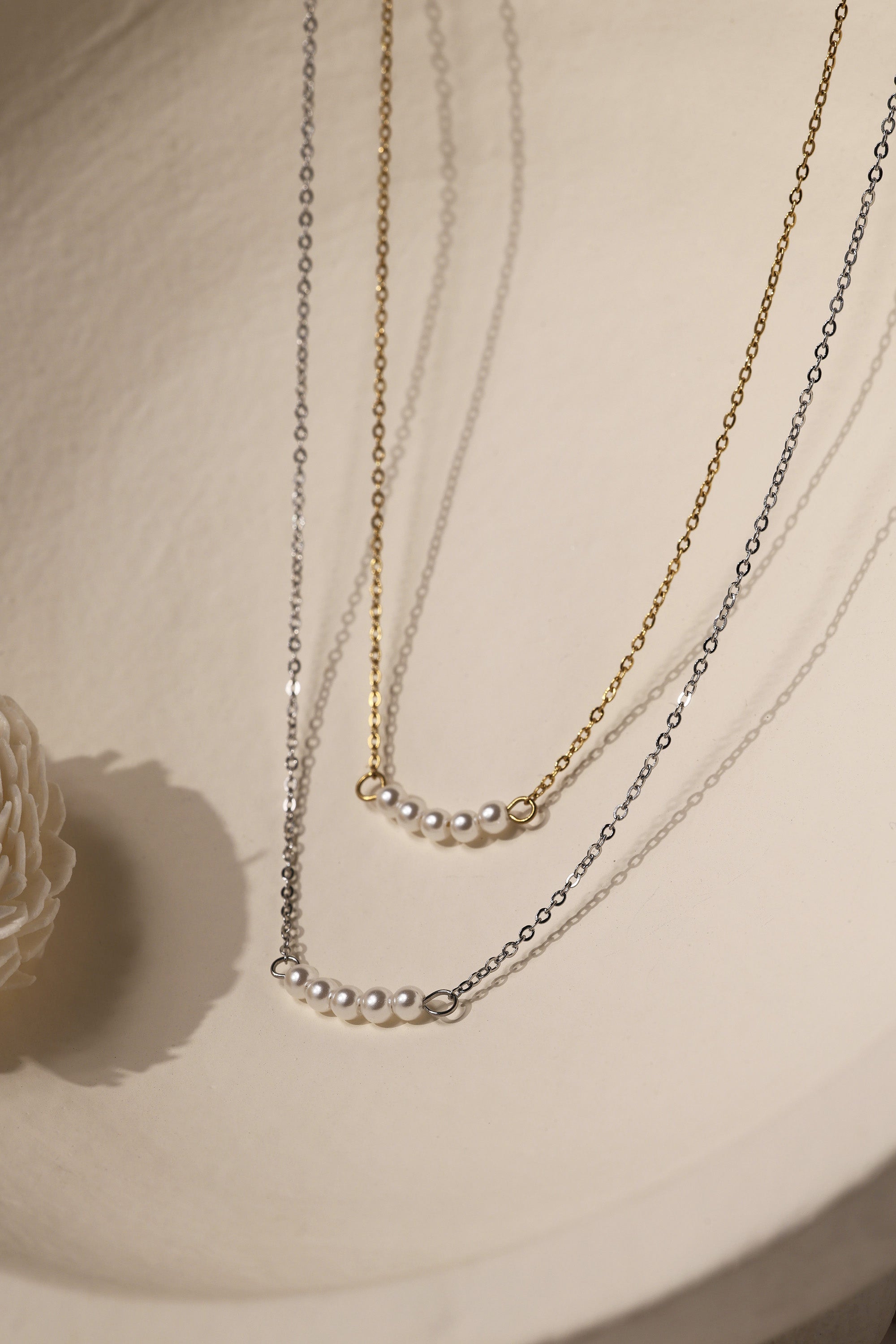 Veloura Pearl Necklace in stainless steel—five dainty pearls floating on a shimmer-ready chain, waterproof and giftable for everyday glow