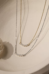 Veloura Pearl Necklace in stainless steel—five dainty pearls floating on a shimmer-ready chain, waterproof and giftable for everyday glow