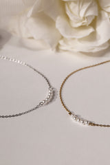 Veloura Pearl Necklace in stainless steel—five dainty pearls floating on a shimmer-ready chain, waterproof and giftable for everyday glow