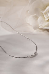 Veloura Pearl Necklace in stainless steel—five dainty pearls floating on a shimmer-ready chain, waterproof and giftable for everyday glow