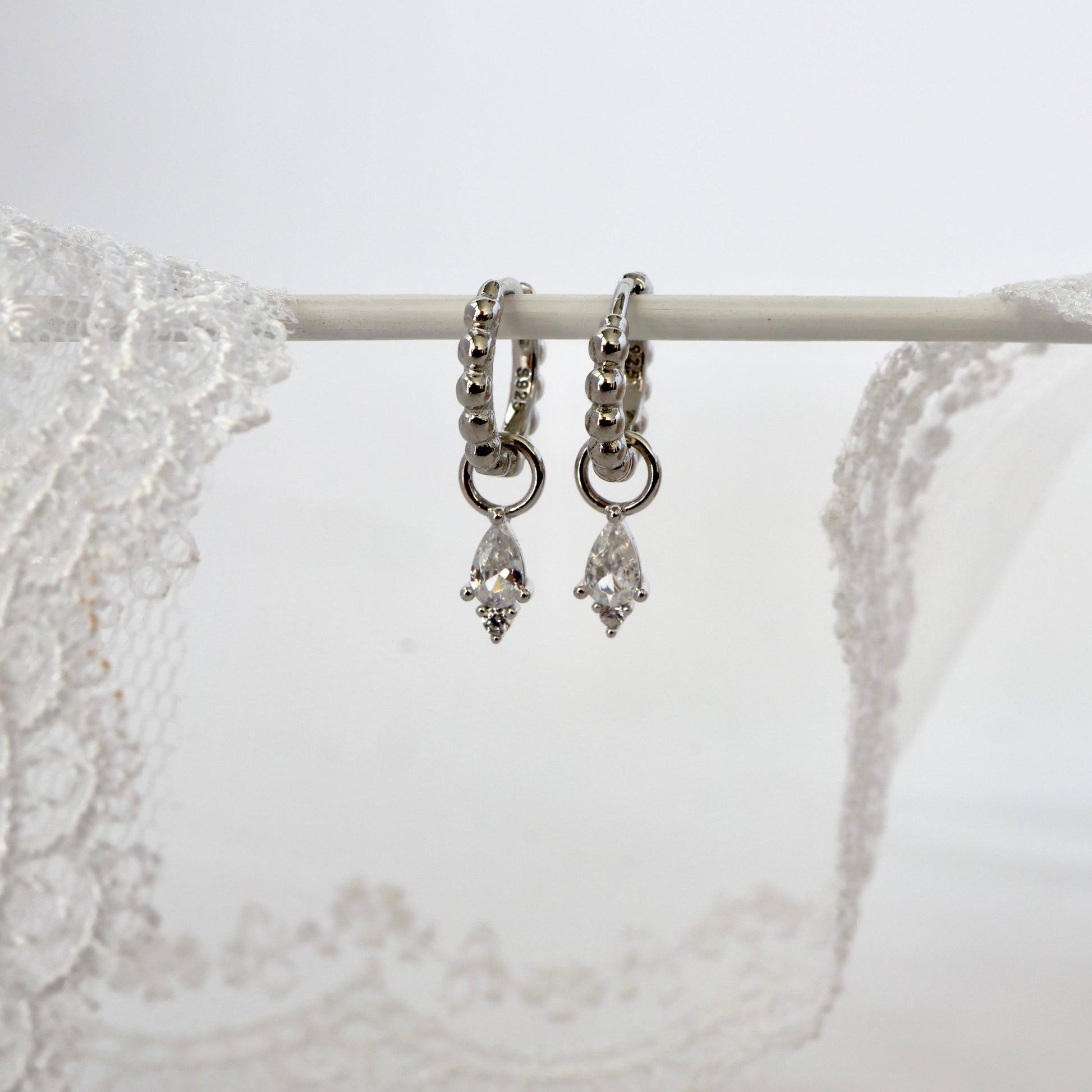 Single Clear Dangle Gold earring Stacks