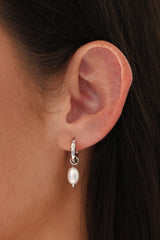 silver hammered hoop earrings with dangling freshwater pearls, worn on ear – hypoallergenic bridal jewellery under $50