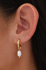 Gold hammered hoop earrings with dangling freshwater pearls, worn on ear – hypoallergenic bridal jewellery under $50