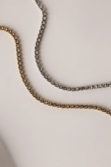 Skinny 2.5mm stainless steel tennis necklace with sparkling stones, waterproof design, casual yet elegant, paired with matching bracelet.