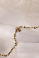 Dainty 18K gold-plated stainless steel bracelet with a single personalised initial charm, symbolising elegance and meaningful style.