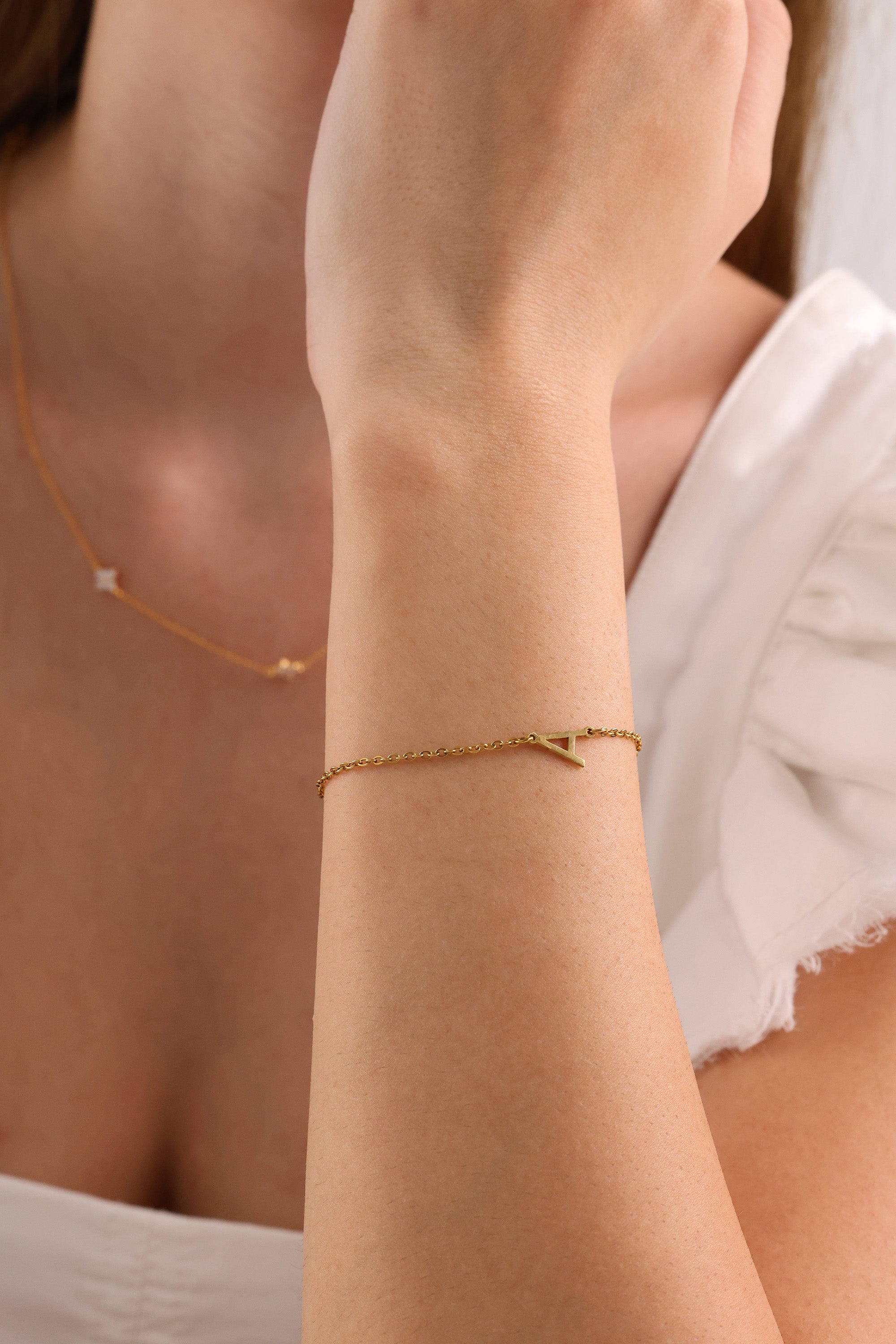 Stainless steel initial bracelet with sleek letter charm, delicate chain, minimalist look, waterproof and tarnish‑resistant