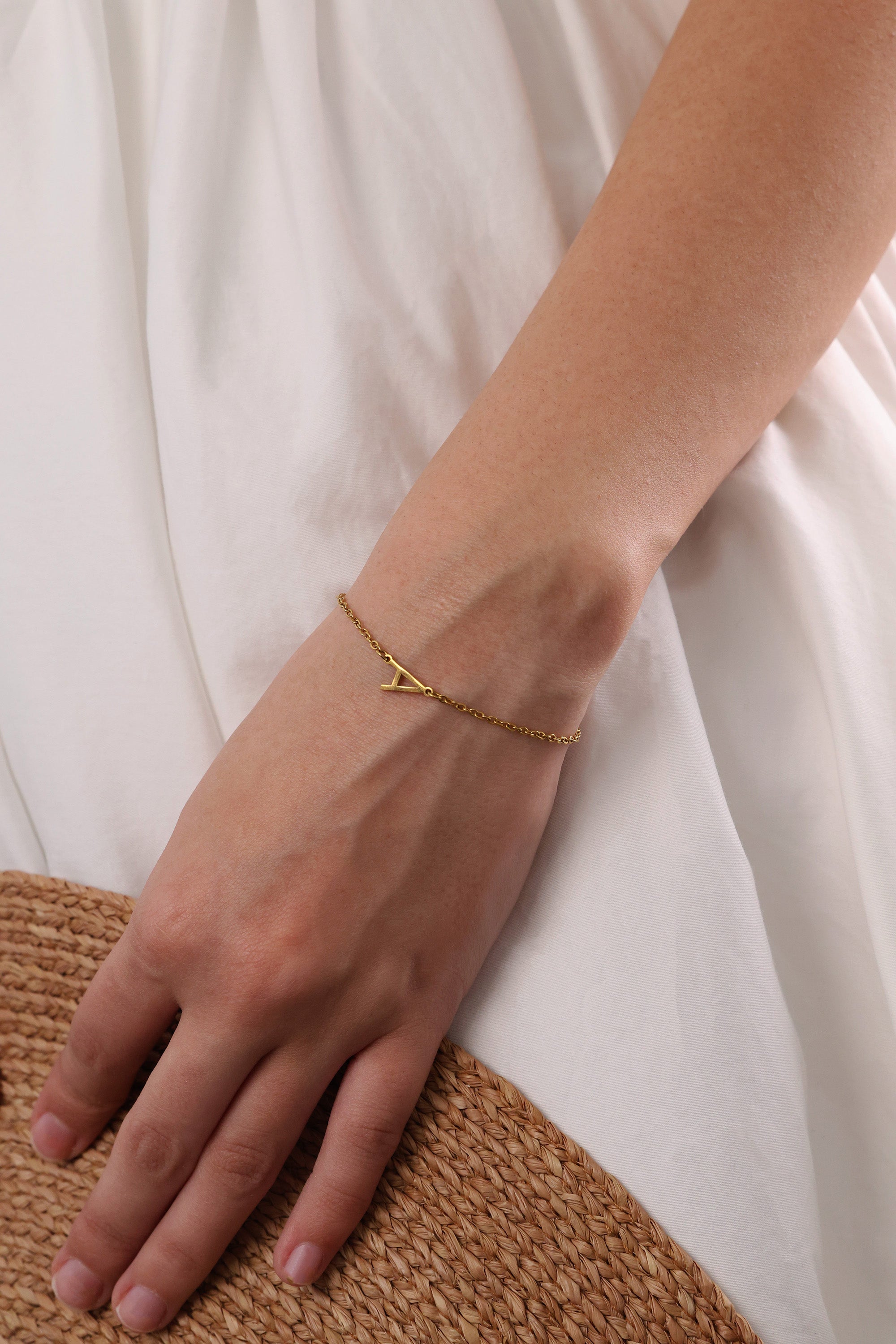 Stainless steel initial bracelet with sleek letter charm, delicate chain, minimalist look, waterproof and tarnish‑resistant