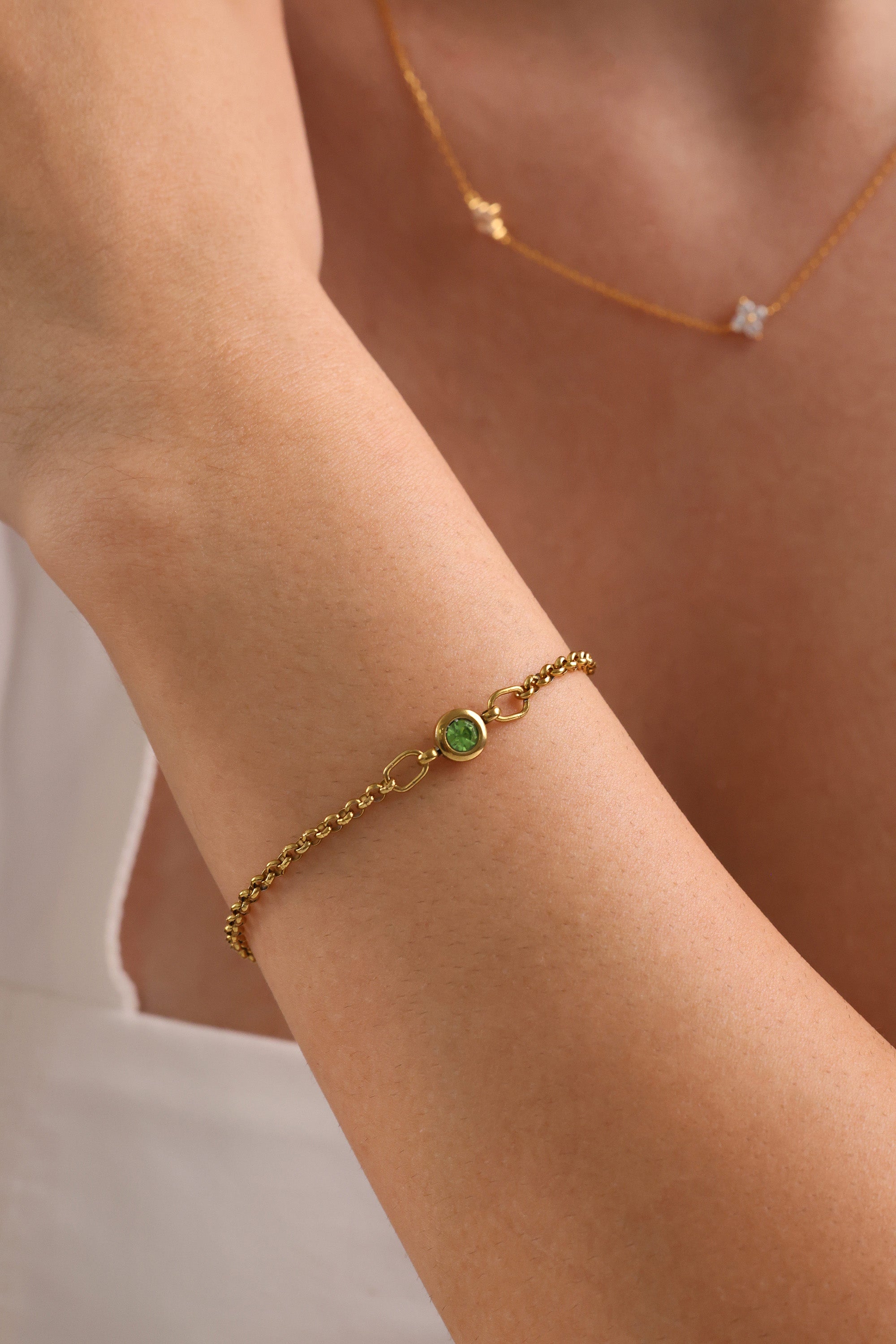 Dainty 18k gold-plated stainless steel birthstone bracelet with a single bezel-set gemstone, symbolizing personal meaning and everyday elegance.