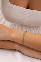 Dainty 18k gold-plated stainless steel birthstone bracelet with a single bezel-set gemstone, symbolizing personal meaning and everyday elegance.