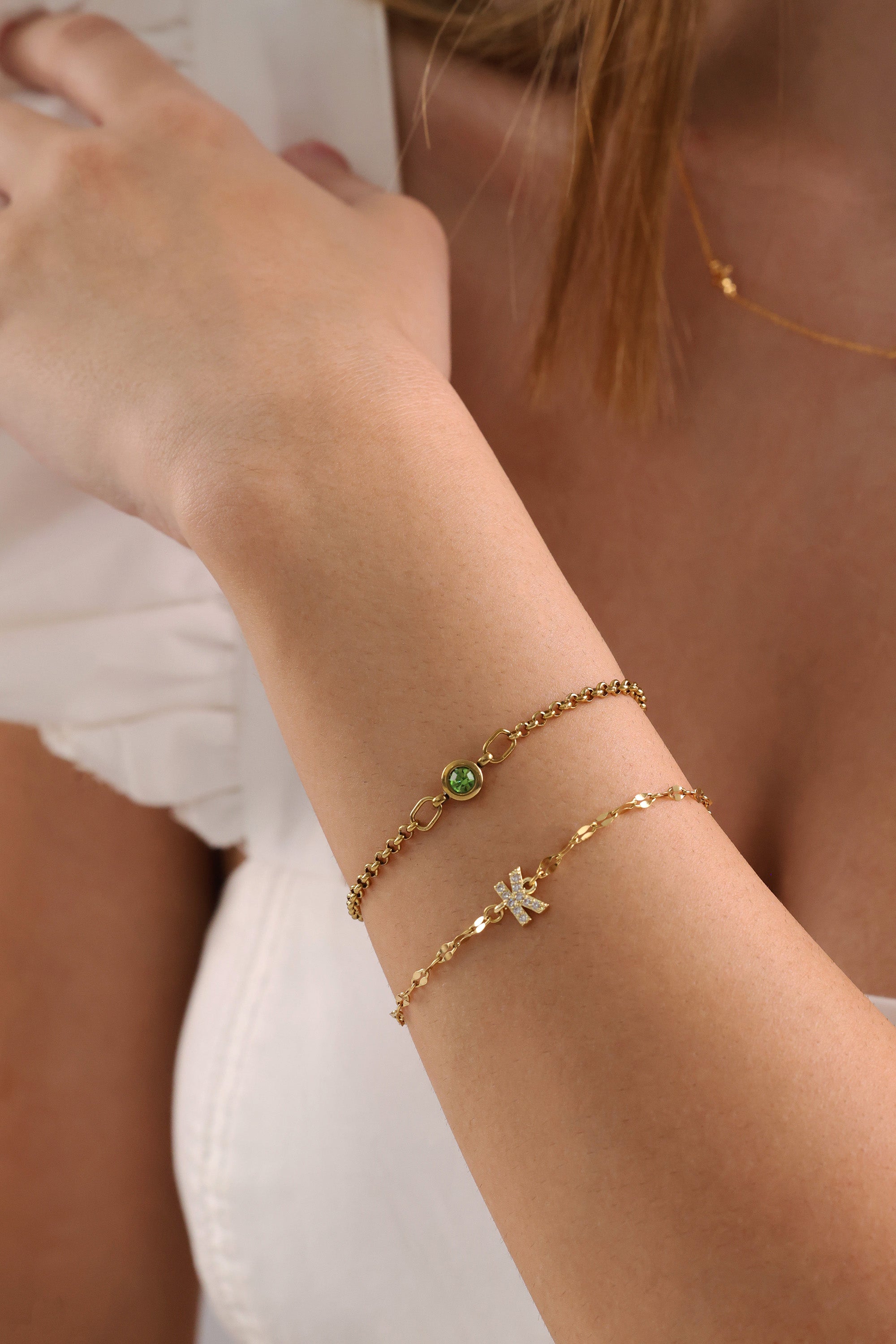 Dainty 18k gold-plated stainless steel birthstone bracelet with a single bezel-set gemstone, symbolizing personal meaning and everyday elegance.
