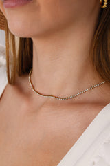 Skinny 2.5mm stainless steel tennis necklace with sparkling stones, waterproof design, casual yet elegant, paired with matching bracelet.