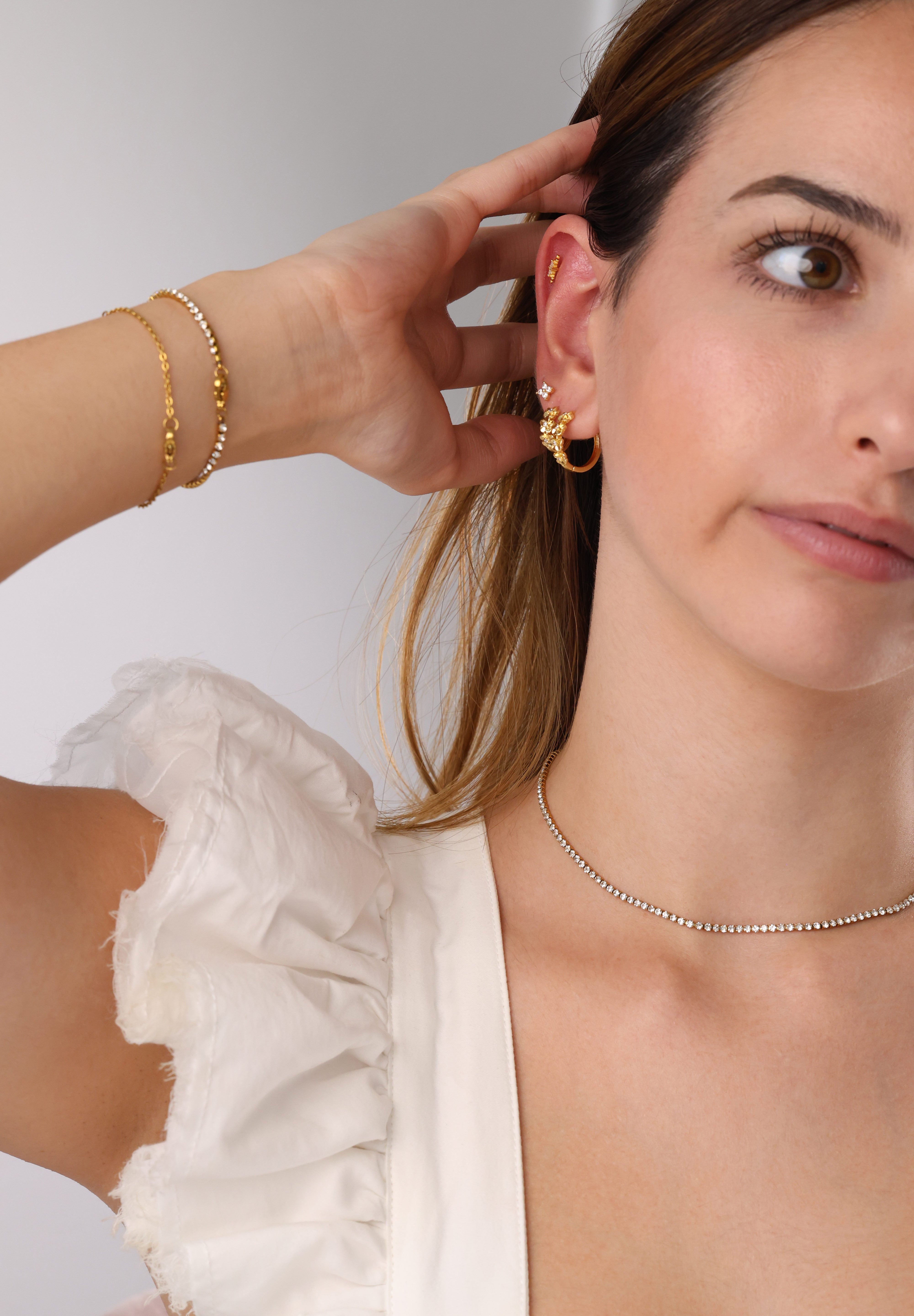 Skinny 2.5mm stainless steel tennis necklace with sparkling stones, waterproof design, casual yet elegant, paired with matching bracelet.