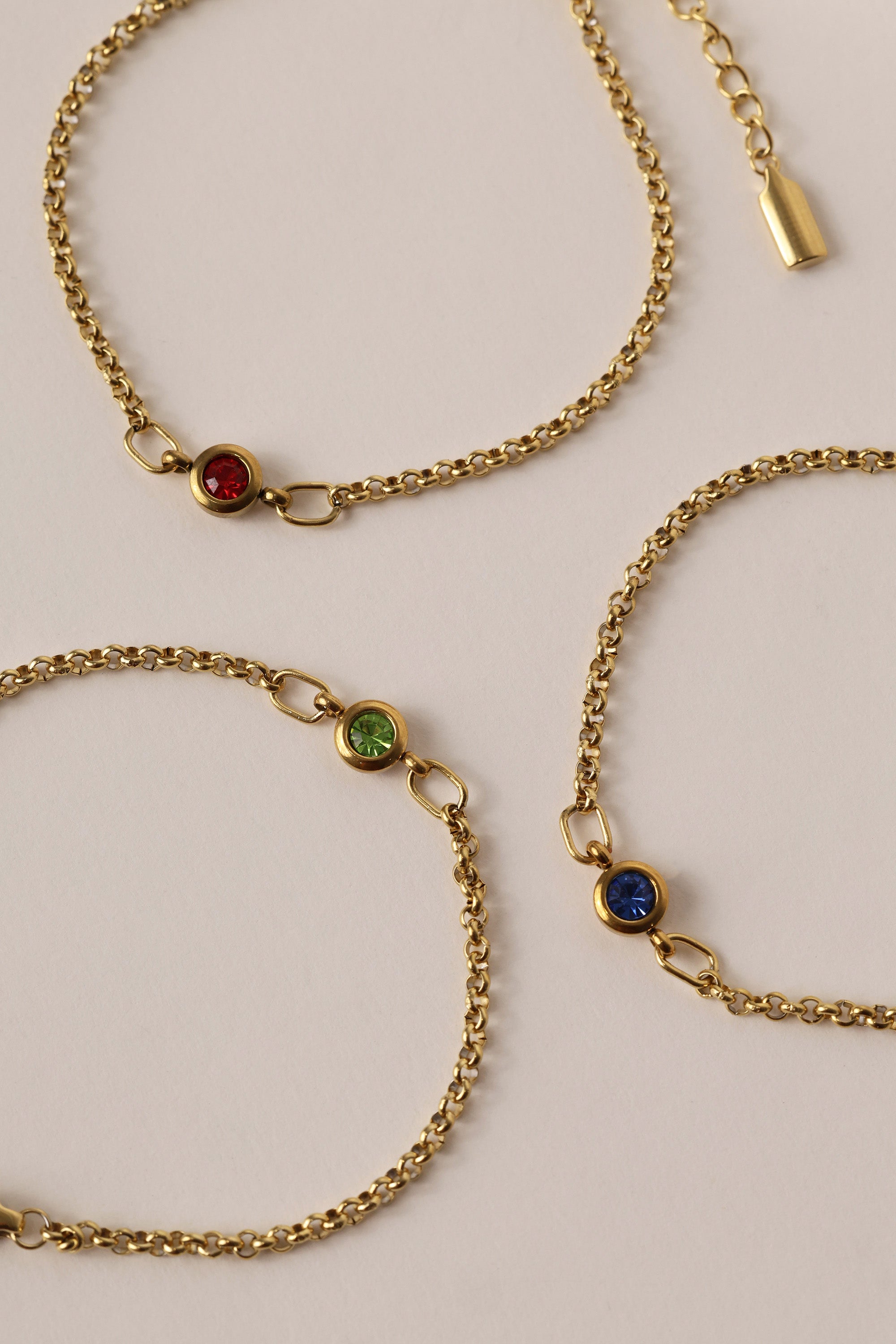 Dainty 18k gold-plated stainless steel birthstone bracelet with a single bezel-set gemstone, symbolizing personal meaning and everyday elegance.