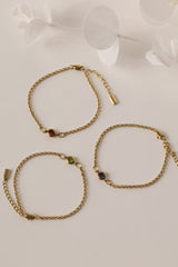 Dainty 18k gold-plated stainless steel birthstone bracelet with a single bezel-set gemstone, symbolizing personal meaning and everyday elegance.