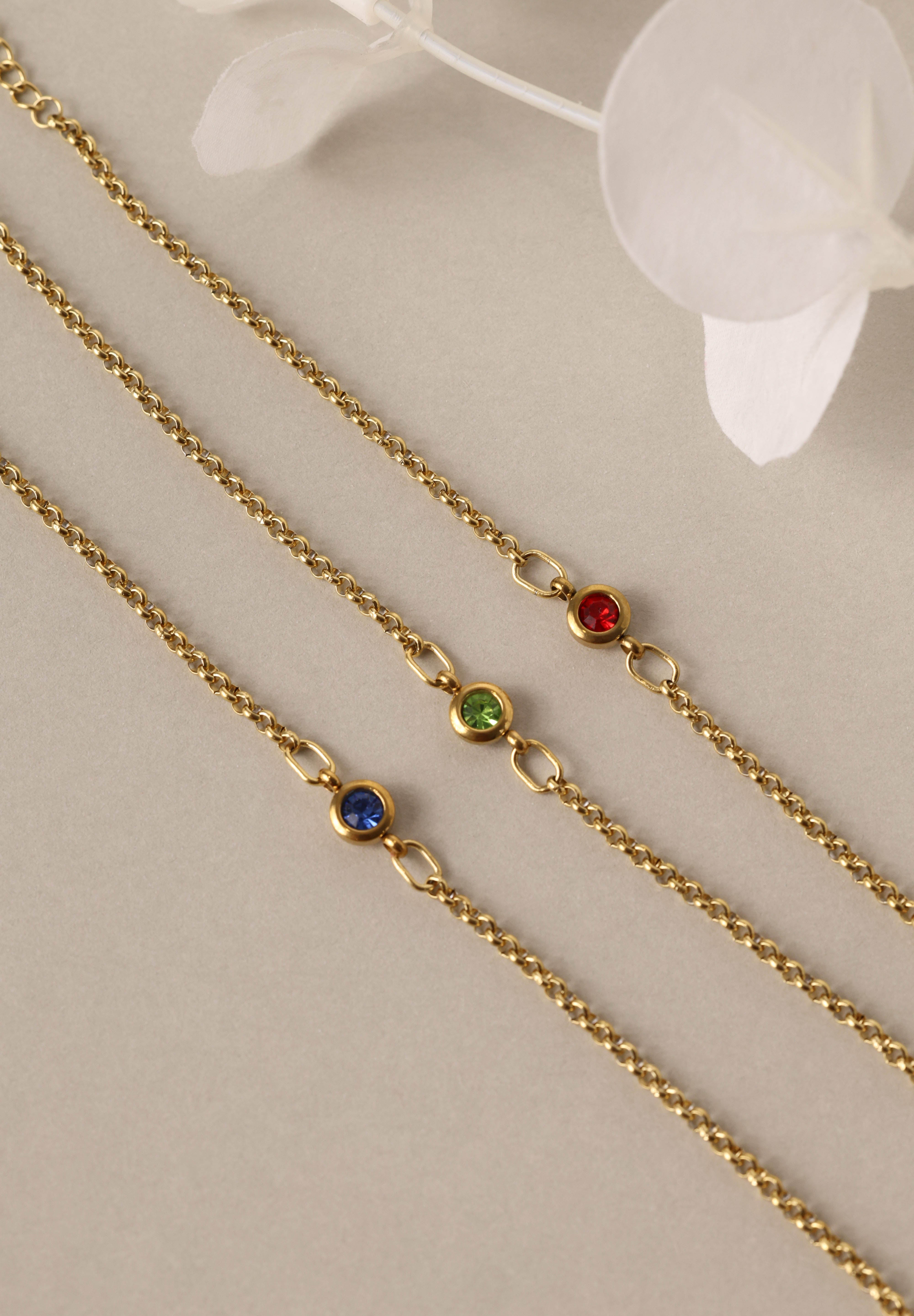 Dainty 18k gold-plated stainless steel birthstone bracelet with a single bezel-set gemstone, symbolizing personal meaning and everyday elegance.