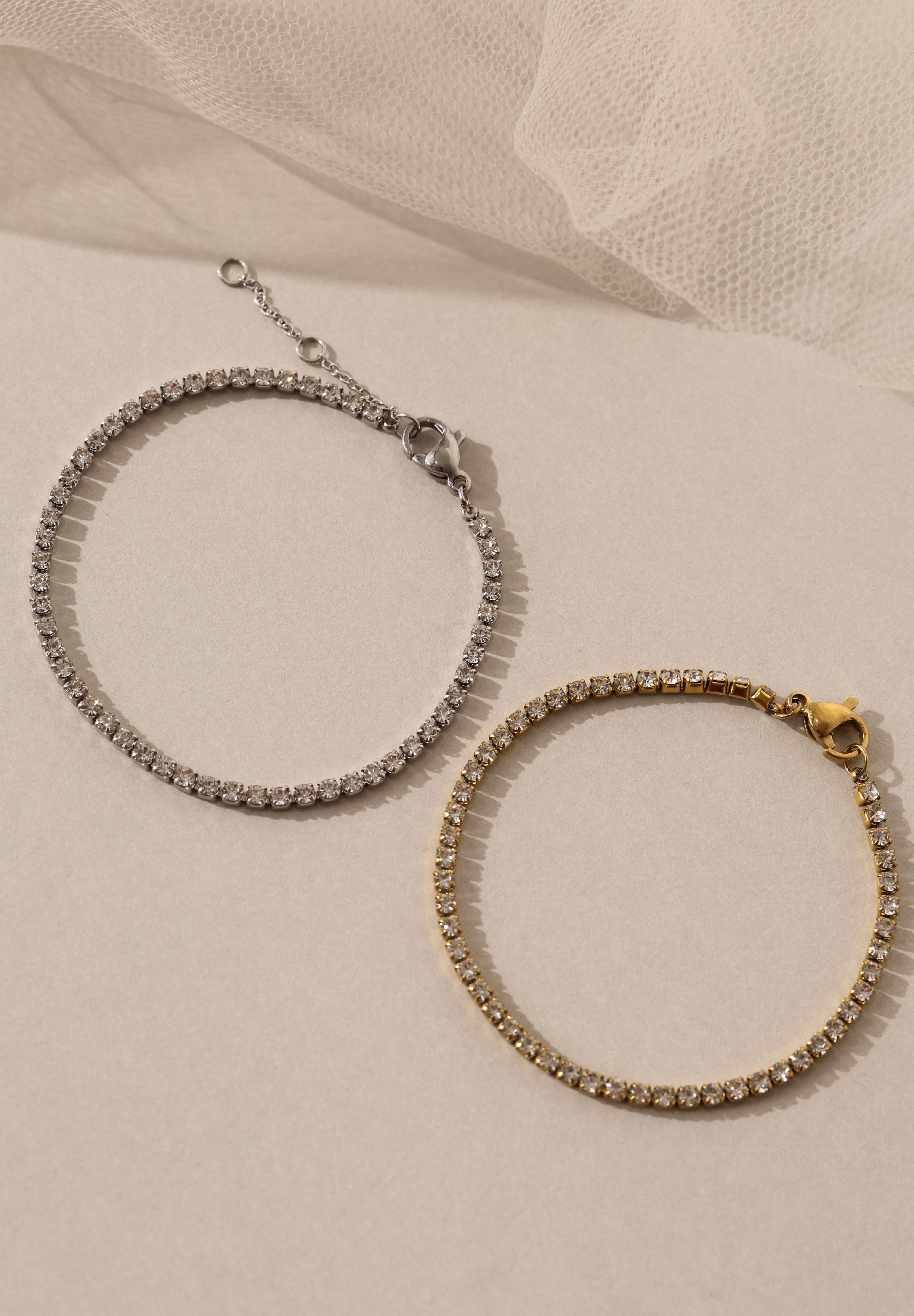 Skinny 2.5mm stainless steel tennis bracelet with sparkling stones, waterproof design, casual yet elegant, paired with matching necklace.