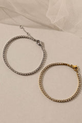 Skinny 2.5mm stainless steel tennis bracelet with sparkling stones, waterproof design, casual yet elegant, paired with matching necklace.