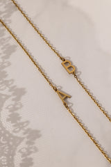 Stainless steel initial bracelet with sleek letter charm, delicate chain, minimalist look, waterproof and tarnish‑resistant