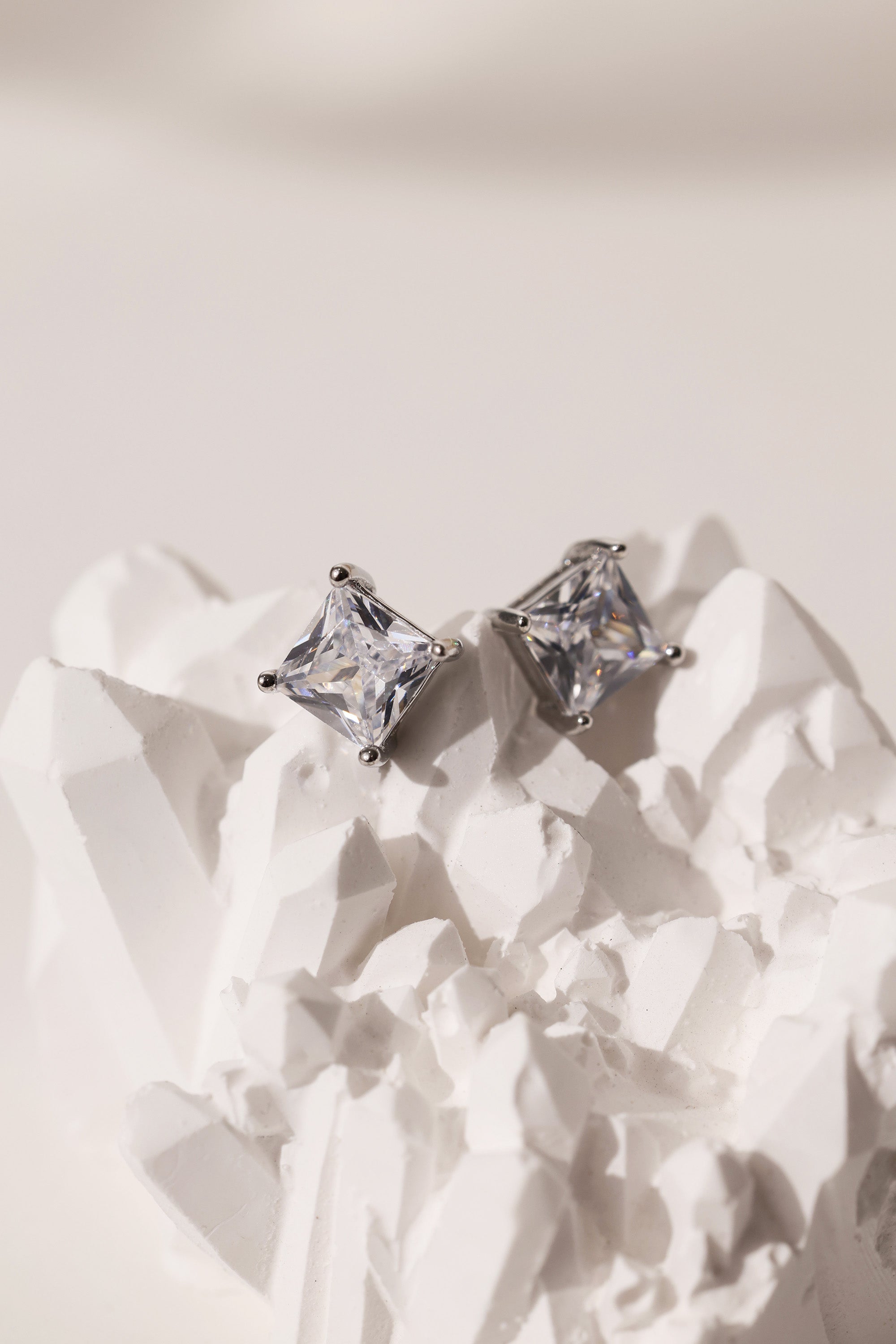Princess cut CZ stud earrings in 9mm, 7mm, and 5mm, set in sterling silver