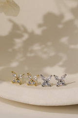 Butterfly cubic zirconia stud earrings — marquise-cut wings over round brilliant stones, 6.3mm x 7.5mm.