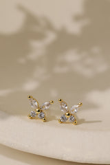 Gold butterfly cubic zirconia stud earrings — two marquise-cut wings above two round brilliant stones.